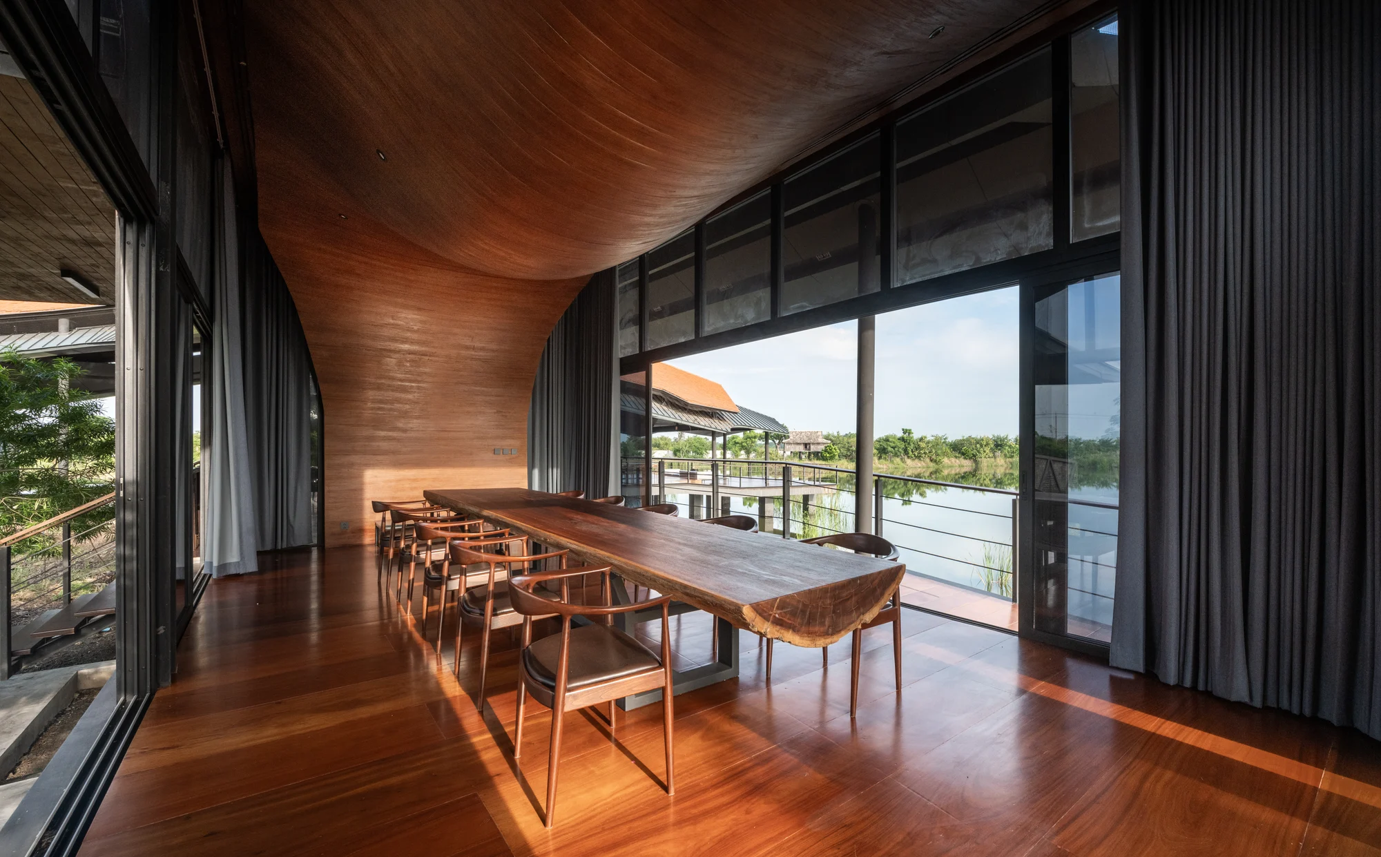 Timber ceiling and glazed dining space at Nongchok House